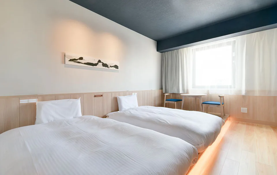 ห้องพักและพื้นที่เตียงของ Vessel Hotel Campana Susukino