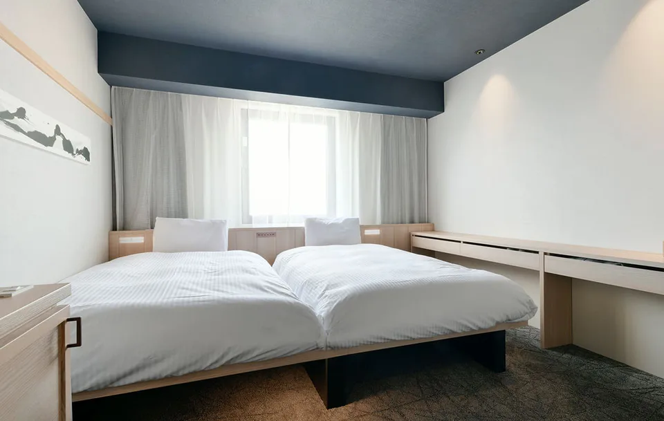 ห้องพักและพื้นที่เตียงของ Vessel Hotel Campana Susukino