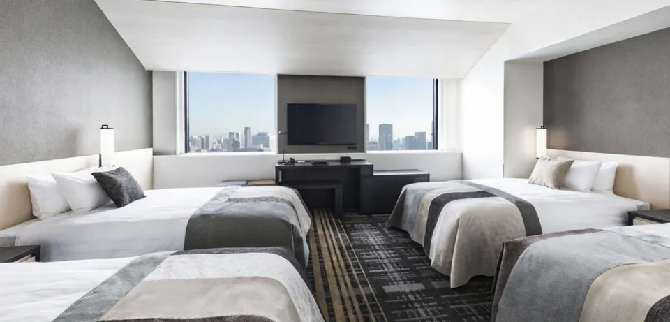 ห้องพักและพื้นที่เตียงของ The Park Front Hotel